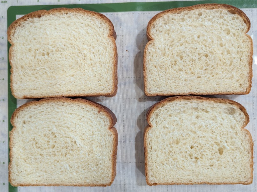 image-1.jpg Four sliced pieces of bread displayed on a pan.