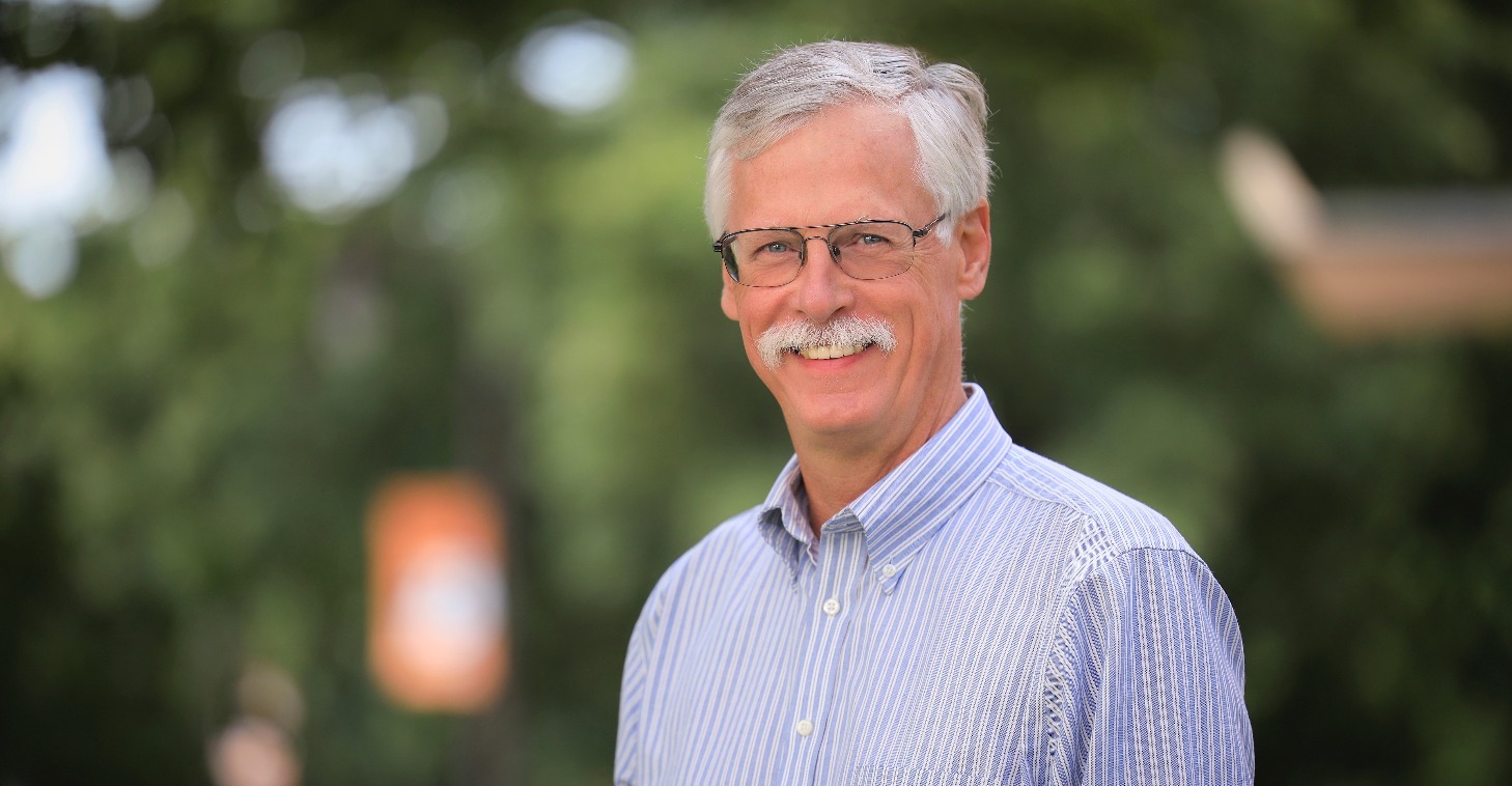 Keith Owens portrait in front of Ag Hall